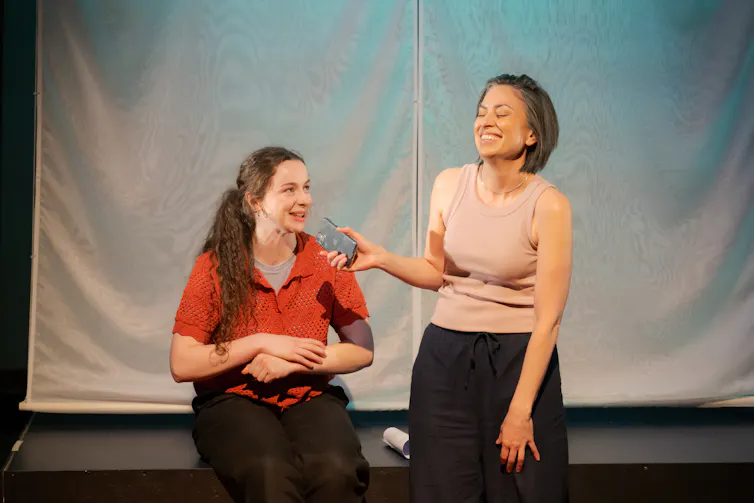 Two women on stage.