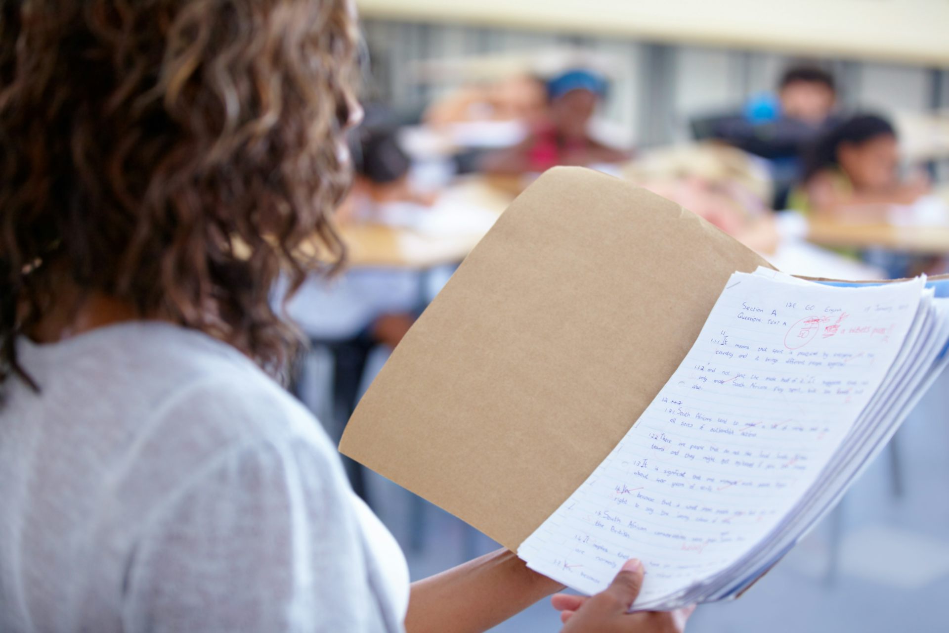 Teacher looking at pupil work
