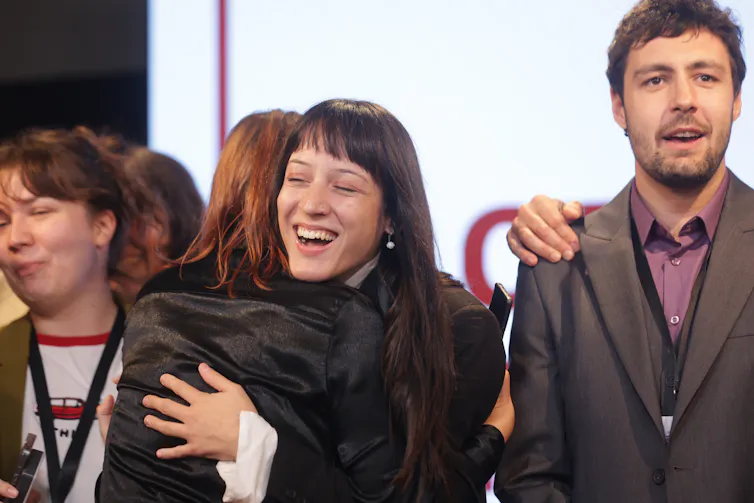 People celebrate at the Student List headquarters in Belgrade.