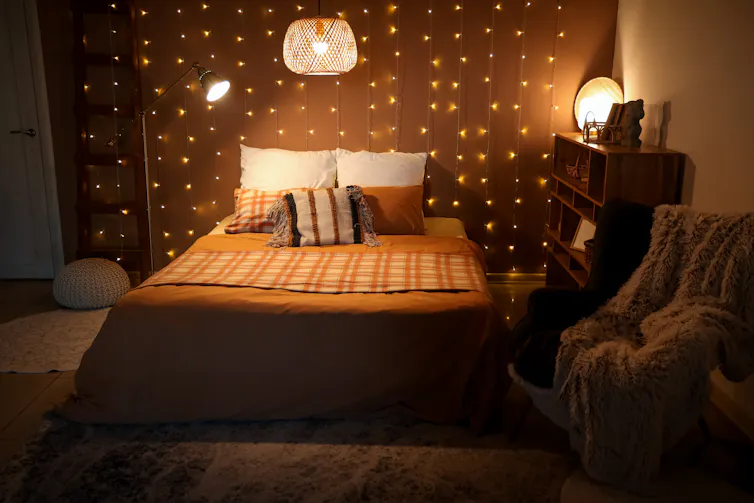 Bedroom with lots of lamps and fairy lights