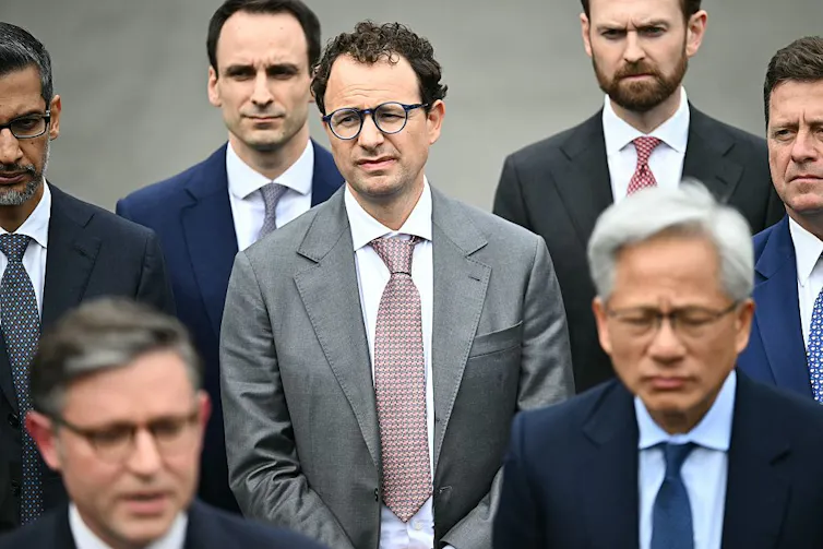 Anthropic CEO Dario Amodei stands with other CEOs