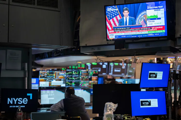 A screen over the floor of the New York Stock Exchange displays a news conference by Federal Reserve Board Chairman Kevin Warsh, Oct. 28, 2026.